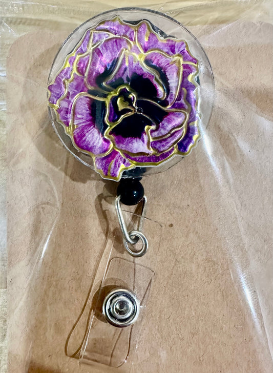 Purple flower badge reel with belt clip