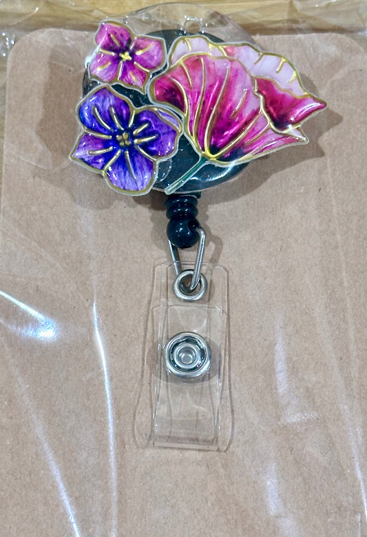 Floral badge reel with belt clip