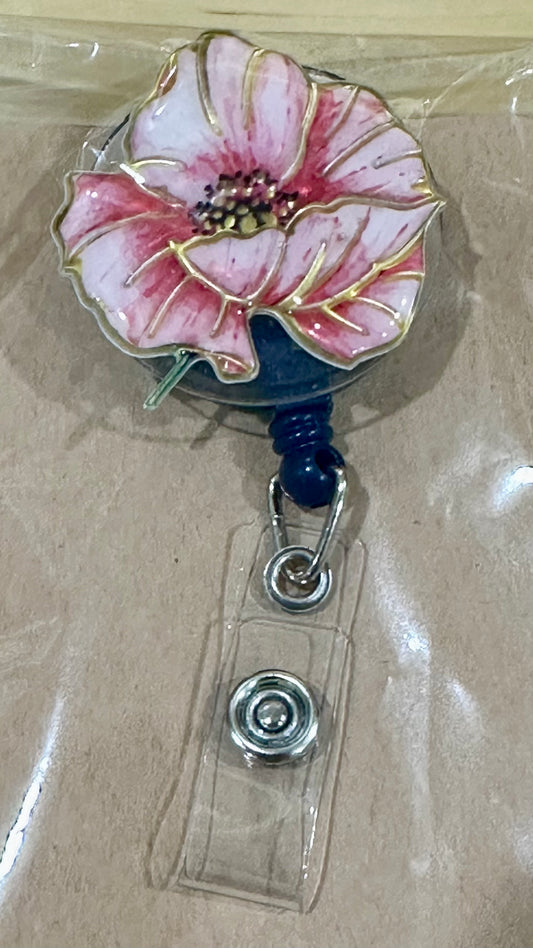 Pink flower badge reel with belt clip