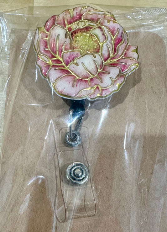 Pink flower badge reel with belt clip