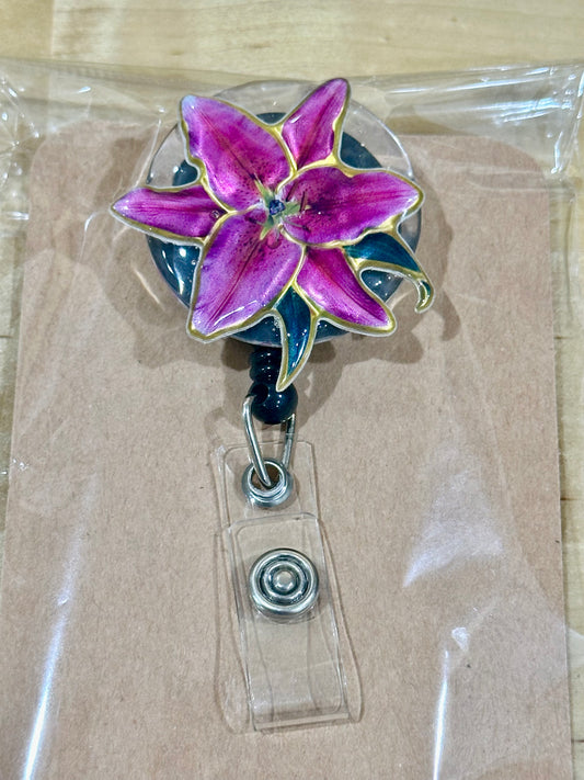 Pink flower badge reel with belt clip