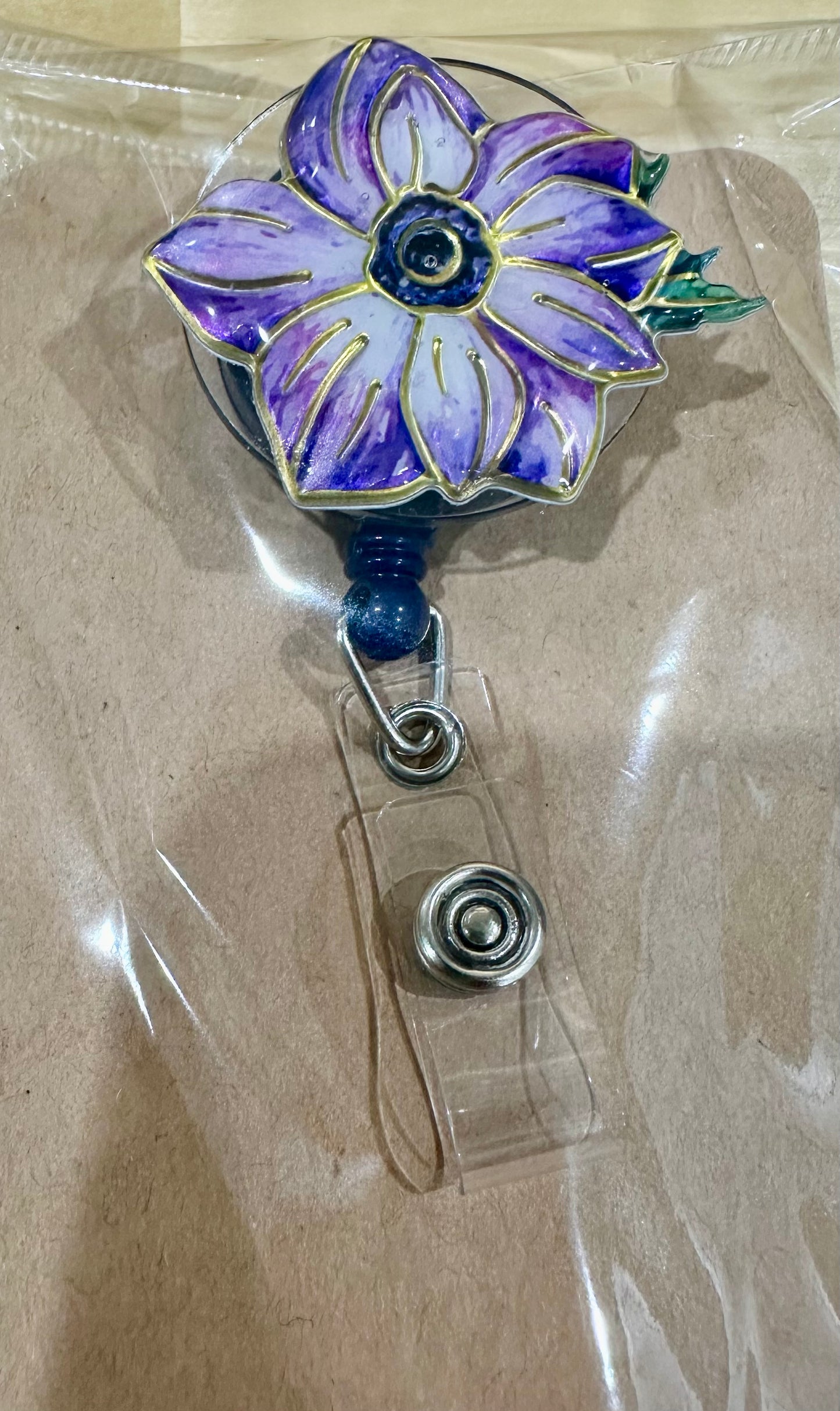 Purple flower badge reel with belt clip