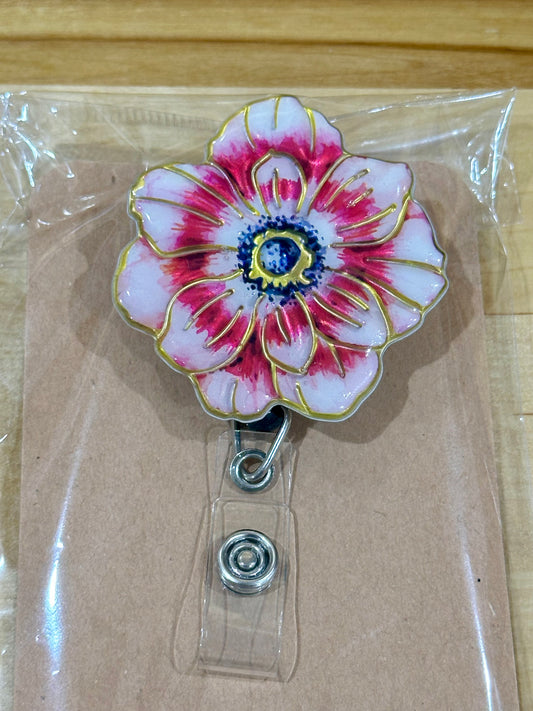 Pink flower badge reel with belt clip