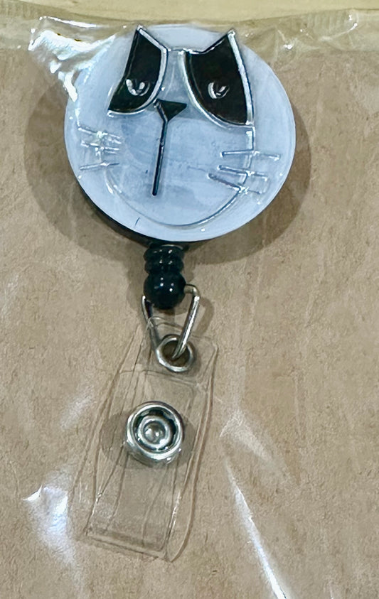 Black and white cat badge reel with belt clip