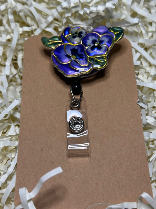 Purple flower badge reel with belt clip